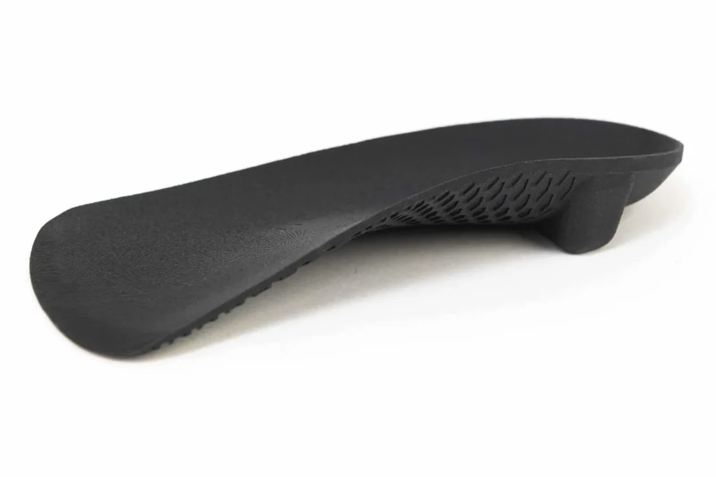 Custom 3D printed orthotic with internal lattice structure, made at our Newcastle clinic