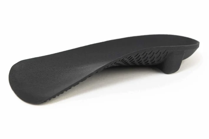 Custom 3D printed orthotic with internal lattice structure, made at our Newcastle clinic