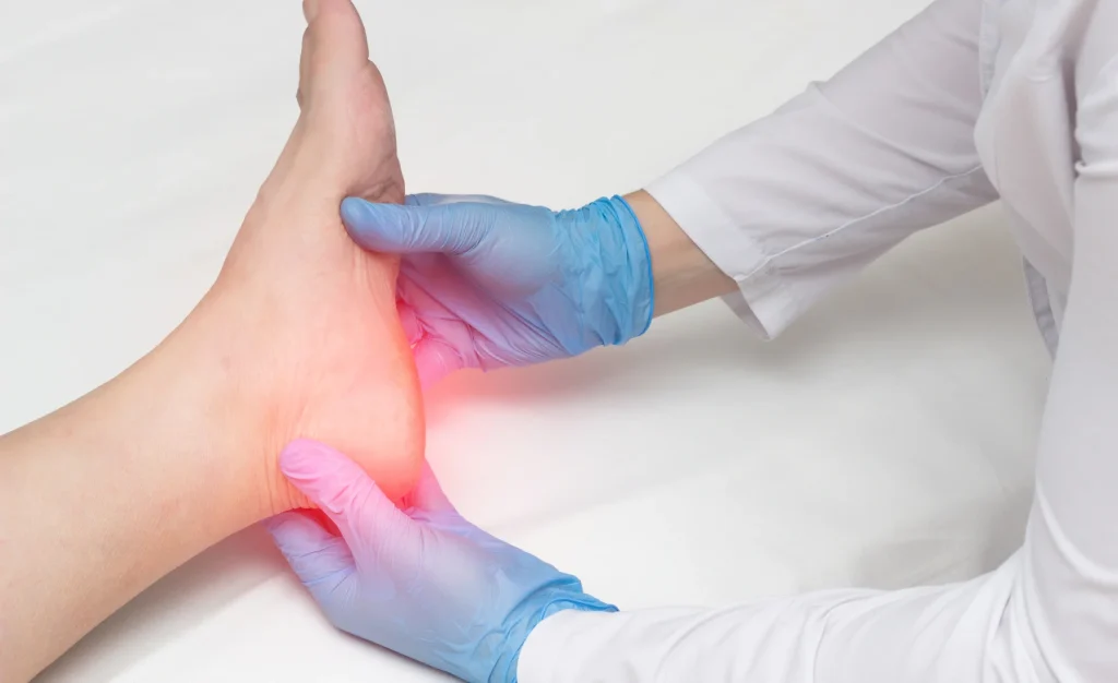 Podiatrist examining a patient's heel during a heel pain assessment